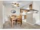 Bright dining area with ceiling fan next to kitchen at 18302 E Kepner Pl # 207, Aurora, CO 80017