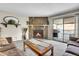 Living room with fireplace, and balcony access at 18302 E Kepner Pl # 207, Aurora, CO 80017