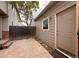 Backyard featuring a wooden fence, concrete ground, patio door and an outdoor entrance door at 438 N Parkside Dr # C, Longmont, CO 80501