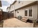Backyard featuring a wooden fence, concrete ground, patio door and an air conditioning unit at 438 N Parkside Dr # C, Longmont, CO 80501