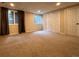 Finished basement with carpet flooring, windows, closet, and neutral wall colors at 438 N Parkside Dr # C, Longmont, CO 80501