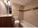 Bathroom featuring decorative wall tiles, a walk-in shower, toilet, and vanity sink at 438 N Parkside Dr # C, Longmont, CO 80501