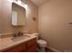 Neutral powder bath featuring a marble countertop and stylish fixtures at 438 N Parkside Dr # C, Longmont, CO 80501