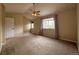Spacious bedroom with carpet, ceiling fan, and ample natural light from large windows at 438 N Parkside Dr # C, Longmont, CO 80501