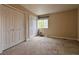 Bedroom with carpet and ample storage in the double closets at 438 N Parkside Dr # C, Longmont, CO 80501