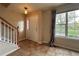 Bright foyer with tile flooring, staircase, and large window with backyard views at 438 N Parkside Dr # C, Longmont, CO 80501