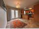 Eat-in kitchen with French doors, wood cabinets, granite counters, and stainless appliances at 438 N Parkside Dr # C, Longmont, CO 80501