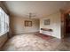 Bright living room showcasing tile flooring, ceiling fan, and a modern console table at 438 N Parkside Dr # C, Longmont, CO 80501