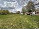 Neighborhood featuring a well maintained grassy field and nice trees at 438 N Parkside Dr # C, Longmont, CO 80501