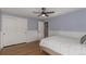 Well-lit bedroom with double door closet and hardwood flooring, providing ample storage space at 2365 S Holly Pl, Denver, CO 80222