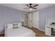 Cozy bedroom with desk, a ceiling fan, closet, and light-colored walls for a serene space at 2365 S Holly Pl, Denver, CO 80222