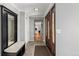 Inviting foyer with tile flooring, coat closet, and a view into the living area at 2365 S Holly Pl, Denver, CO 80222