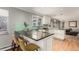 Kitchen island with granite countertops and bar stool seating at 2365 S Holly Pl, Denver, CO 80222