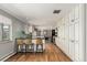 Bright kitchen featuring white cabinetry, counter seating, and modern appliances at 2365 S Holly Pl, Denver, CO 80222