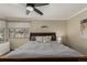 Serene main bedroom featuring a ceiling fan, soft lighting, and a calming color palette at 2365 S Holly Pl, Denver, CO 80222