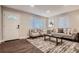 Bright living room with hardwood floors, comfy seating, and a stylish coffee table at 2401 W 39Th Ave, Denver, CO 80211