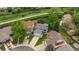 Aerial shot showcasing a home with solar panels in a tree-lined neighborhood with green lawns at 9150 W 94Th Ave, Westminster, CO 80021