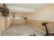 Spacious finished basement featuring plush carpeting, a TV, and a deer head decoration mounted on the wall at 9150 W 94Th Ave, Westminster, CO 80021