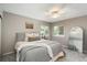 Cozy bedroom features carpet floors, soft natural light, and a full-sized bed with comfy grey bedding at 9150 W 94Th Ave, Westminster, CO 80021