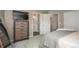 Bright bedroom with carpet, tv, dresser, and access to the en suite bathroom at 9150 W 94Th Ave, Westminster, CO 80021