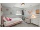 Bright bedroom with pink bed, colorful decor, gray carpet, and natural light from a window at 9150 W 94Th Ave, Westminster, CO 80021