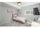 Bright bedroom with a cozy bed, a sunshine wall decoration, and a comfy chair, creating a cheerful atmosphere at 9150 W 94Th Ave, Westminster, CO 80021