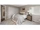 Comfortable bedroom with carpet flooring, double door closet, nightstand, and windows for natural light at 9150 W 94Th Ave, Westminster, CO 80021