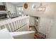 Bright entryway with wood floors, stairs leading to the living room, and doors leading outside at 9150 W 94Th Ave, Westminster, CO 80021