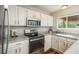 Well-maintained kitchen featuring stainless steel appliances, ample counter space, and bright natural light at 9150 W 94Th Ave, Westminster, CO 80021