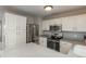 Spacious kitchen featuring stainless steel appliances, modern cabinetry, and ample counter space at 9150 W 94Th Ave, Westminster, CO 80021