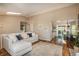 Bright and open living area with vaulted ceilings, skylights, and seamless access to the dining and kitchen at 9150 W 94Th Ave, Westminster, CO 80021