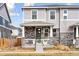 Charming two-story home with a welcoming porch and beautiful stone accents, enhancing its curb appeal at 21823 E 8Th Ave, Aurora, CO 80018