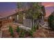 A low-maintenance backyard featuring a private hot tub and lush landscaping at 6674 Fonder Villa Dr, Parker, CO 80134