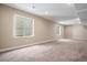 Finished basement featuring natural light, neutral tones, and ample space for various uses at 6674 Fonder Villa Dr, Parker, CO 80134