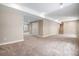Spacious finished basement with neutral paint, plush carpeting, and potential for customization at 6674 Fonder Villa Dr, Parker, CO 80134