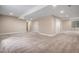 Large finished basement with ample open space and neutral tones, ready for personalization at 6674 Fonder Villa Dr, Parker, CO 80134