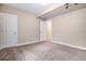 Cozy bedroom with neutral walls, plush carpet, recessed lighting, and two closets at 6674 Fonder Villa Dr, Parker, CO 80134