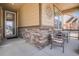 Charming front porch with stone accents and comfortable seating at 6674 Fonder Villa Dr, Parker, CO 80134