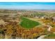 Scenic aerial view of Pradera's golf course showcasing its lush fairways and mature landscaping at 6674 Fonder Villa Dr, Parker, CO 80134