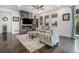 Inviting living room featuring a marble fireplace, ceiling fan, and sliding door access to outdoor deck at 6674 Fonder Villa Dr, Parker, CO 80134