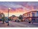 Charming street view with lights, local businesses, and parked cars, showcasing the lively neighborhood atmosphere at 6674 Fonder Villa Dr, Parker, CO 80134