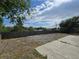 Spacious backyard with a gravel area, a concrete patio, and a tall wooden fence for privacy at 2865 Carnation Way, Thornton, CO 80229