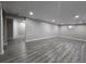 Spacious finished basement featuring wood-look floors at 2865 Carnation Way, Thornton, CO 80229