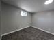 Cozy bedroom with carpeted floors and a bright window at 2865 Carnation Way, Thornton, CO 80229