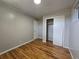 Bright bedroom featuring a closet and original hardwood floors at 2865 Carnation Way, Thornton, CO 80229