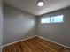 Comfortable bedroom with natural light and hardwood floors at 2865 Carnation Way, Thornton, CO 80229