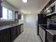 A well-lit kitchen features stainless steel appliances and granite countertops at 2865 Carnation Way, Thornton, CO 80229