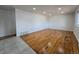 Spacious living room with original hardwood floors and plenty of natural light at 2865 Carnation Way, Thornton, CO 80229
