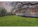 A spacious backyard with an open patio and large windows overlooking the outdoor area at 5467 W Hinsdale Pl, Littleton, CO 80128