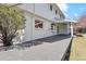 Expansive backyard deck with white brick exterior, offering seamless indoor-outdoor living at 5467 W Hinsdale Pl, Littleton, CO 80128